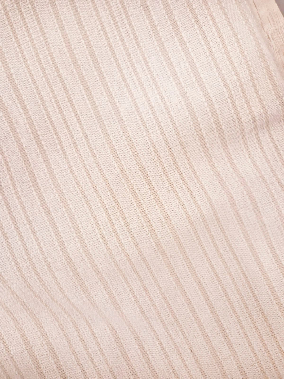 Pantalón de tela acanalada beige con textura vertical
