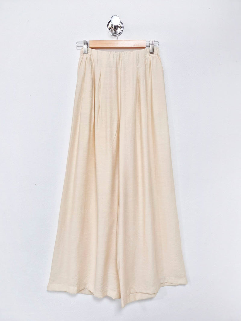 Pantalón palazzo crema de tiro alto y pierna ancha